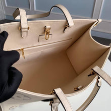 Load image into Gallery viewer, Louis Vuitton Bicolor OnTheGo PM Bag - LUXURY KLOZETT