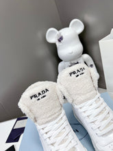 Load image into Gallery viewer, Prada Leather And Shearling High Top Sneakers