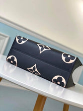 Load image into Gallery viewer, Louis Vuitton Crafty OnTheGo GM Bag - LUXURY KLOZETT