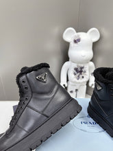 Load image into Gallery viewer, Prada Leather And Shearling High Top  Sneakers
