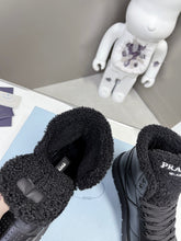 Load image into Gallery viewer, Prada Leather And Shearling High Top  Sneakers
