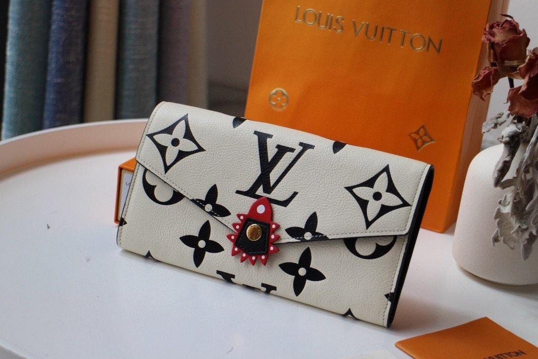 Louis Vuitton Crafty Sarah Wallet - LUXURY KLOZETT