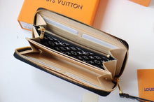 Load image into Gallery viewer, Louis Vuitton Crafty Zippy Wallet - LUXURY KLOZETT
