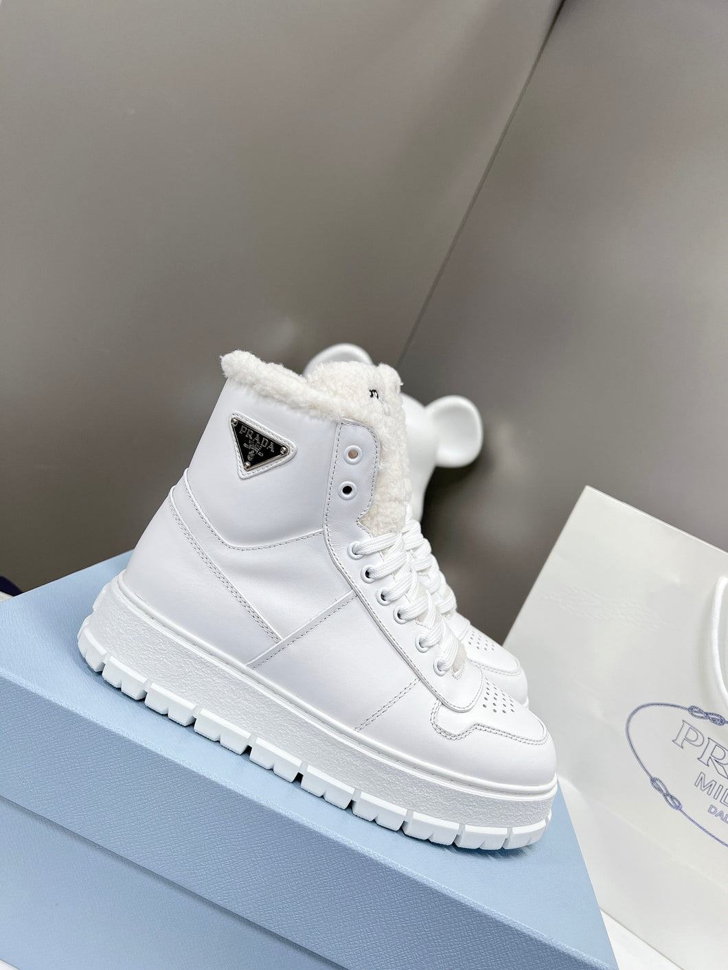 Prada Leather And Shearling High Top  Sneakers