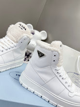 Load image into Gallery viewer, Prada Leather And Shearling High Top  Sneakers
